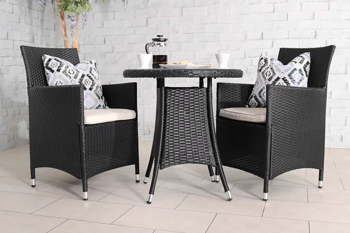 View Black Synthetic Rattan 2 Seater Garden Bistro Set 2 Stackable Armchairs With Waterproof Cream Cushions Round Table With Black Glass Top Cannes information