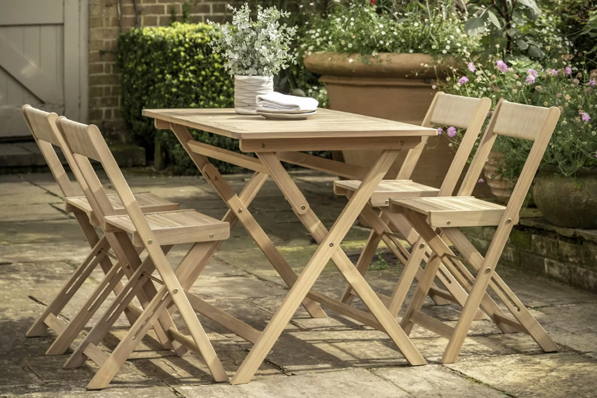 View Lindos Wooden Outdoor Folding Dining Set With Table 4 Chairs Folds Easily For Storage Slatted Design Allows Rain To Run Off Easily information