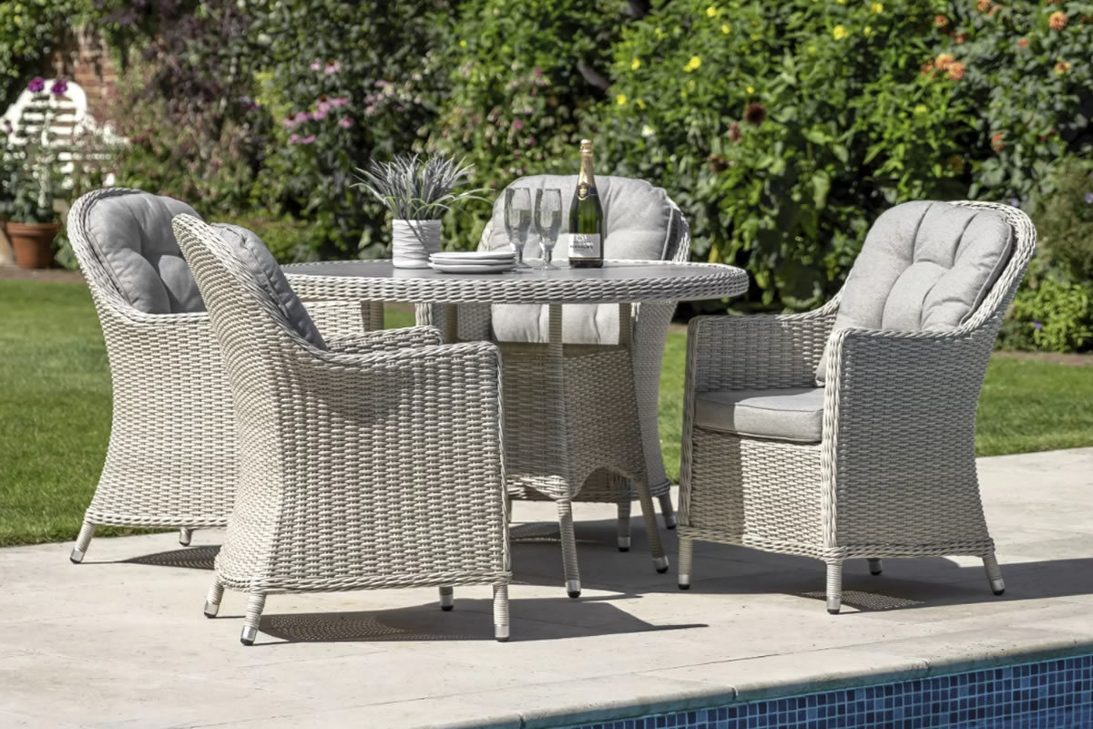 View Holton 4 Seater Rattan Outdoor Garden Dining Set Including Round Table With Easy Clean Glass Table Top Deeply Padded Zipped Grey Cushions  information